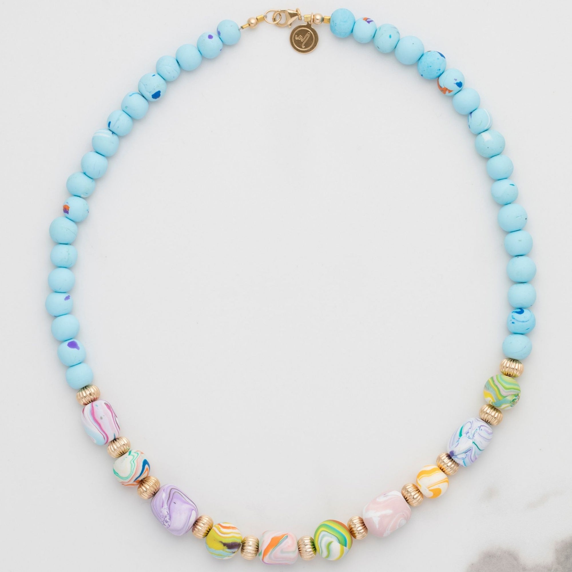 Marina-Ra Handmade Beads, quality gold filled findings and Marina-ra insignia. Beautiful Luxurious Packaging. Hand Assembled. Unique Gift. Stunning Necklace. multicoloured beads, white, blue beads. Trademark